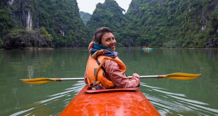 Woman kayaking in a scenic lake