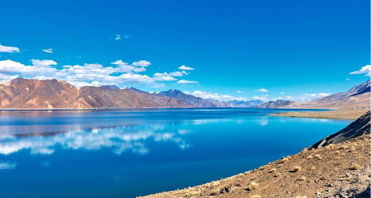Crystal clear lake with reflections of mountains.