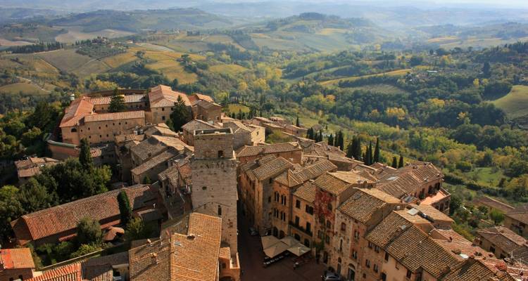Aerial view of a historic town with surrounding countryside.