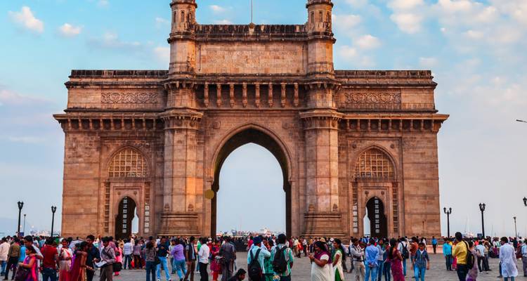Crowded area with people near Gateway of India.