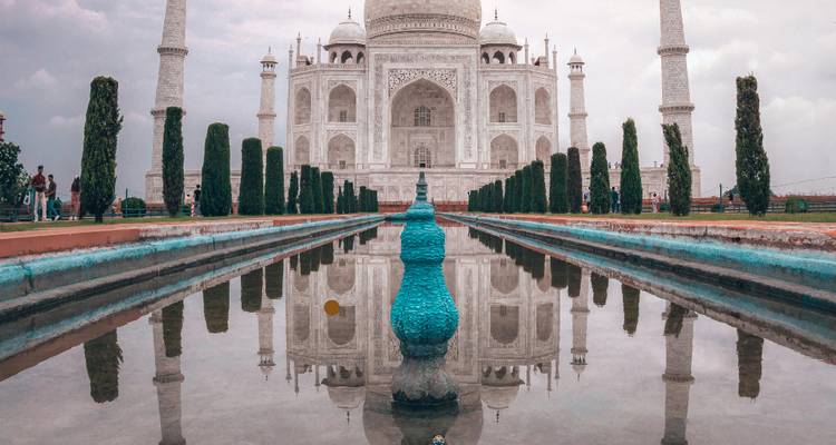 The Taj Mahal reflected in a long pool.