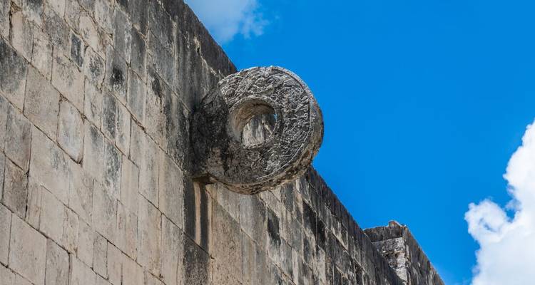 A stone hoop on the wall of an ancient Mayan ball court.