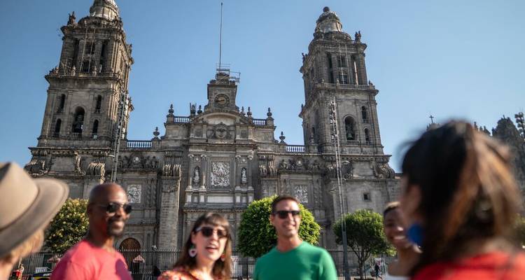 Group of people in front of a large historic cathedral.