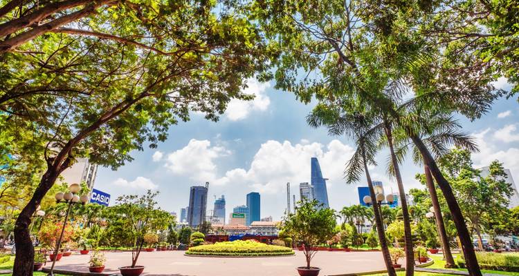 Urban park with skyscrapers in the background.