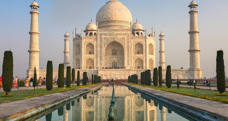 The iconic view of the Taj Mahal reflected in a pond.