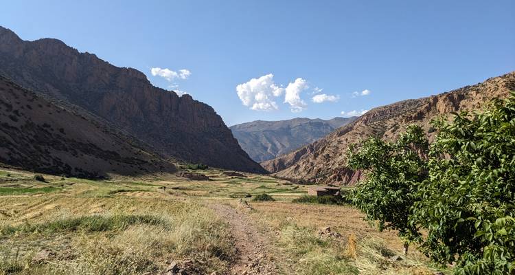 A valley with mountains and clear skies.