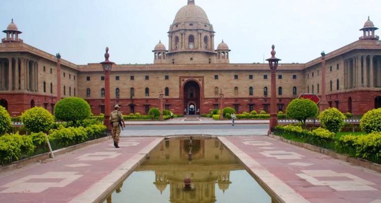 Rashtrapati Bhavan in Delhi, India with people in front.