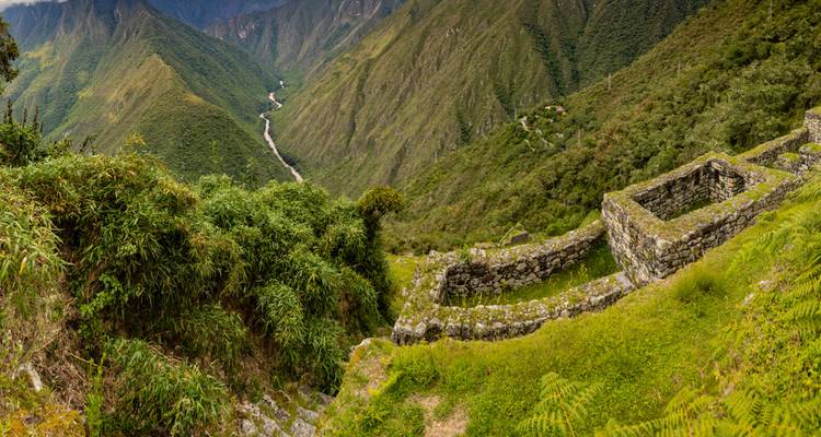 Ruins with a stunning view of lush green valleys.