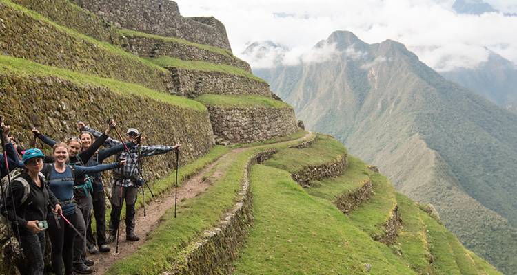 Hikers cheering on an ancient Incan trail.