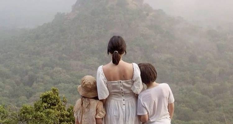 Family admiring a distant mountain view.