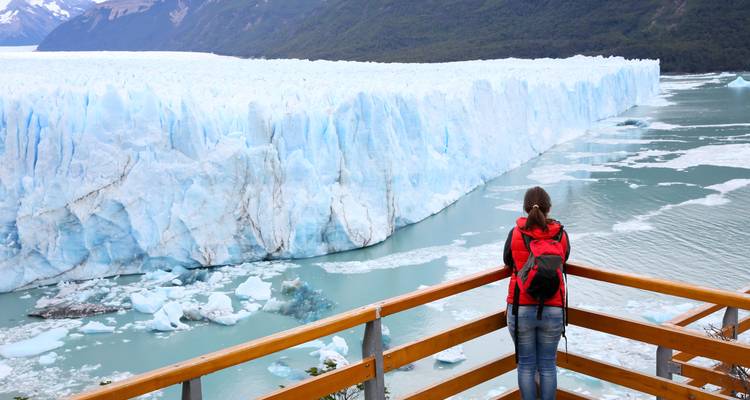 Person viewing large glacier in El Calafate.
