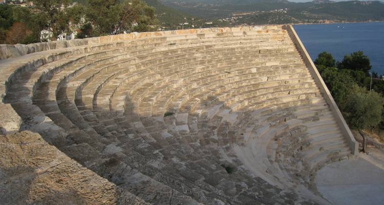 Ancient stone theater overlooking the coastline.
