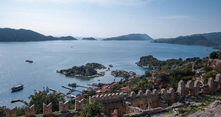 Scenic coastal view with islands and boats.