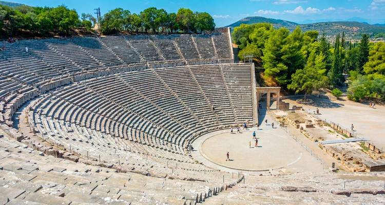 Epidaurus Amphitheatre in Greece with tourists exploring.