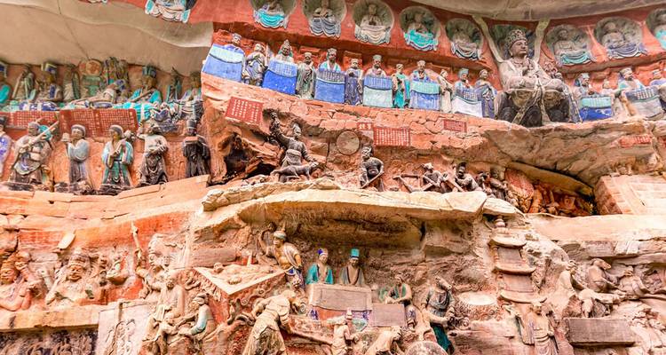 Rock carvings of ancient figures and deities.