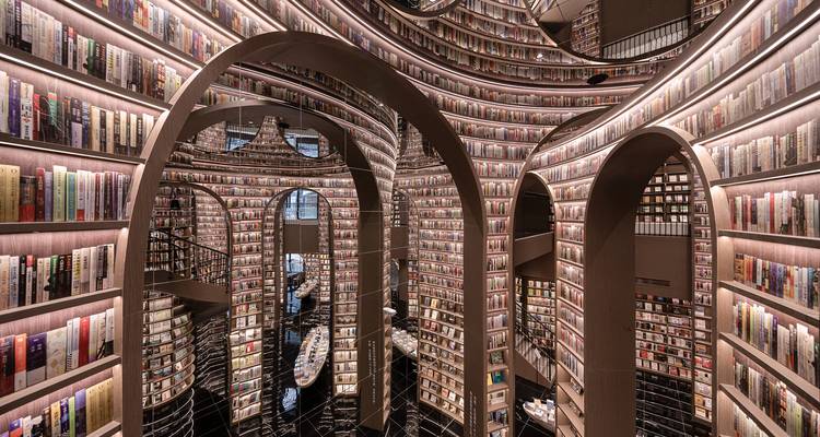 Modern library interior with dramatic bookshelves.