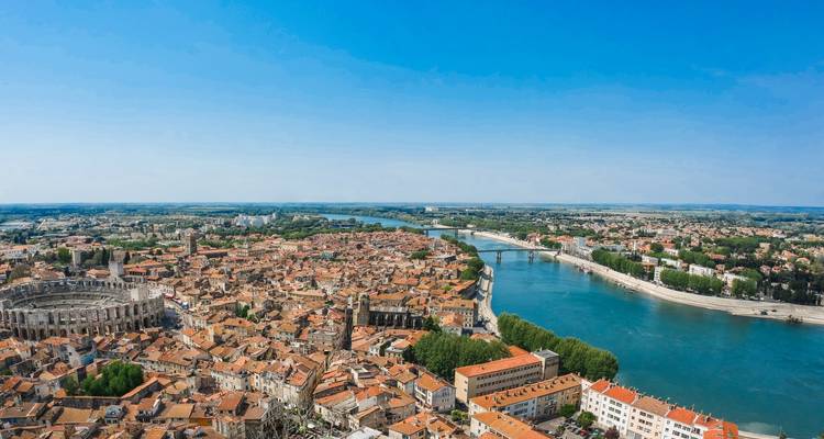 Aerial view of a historic city with a river running through it.