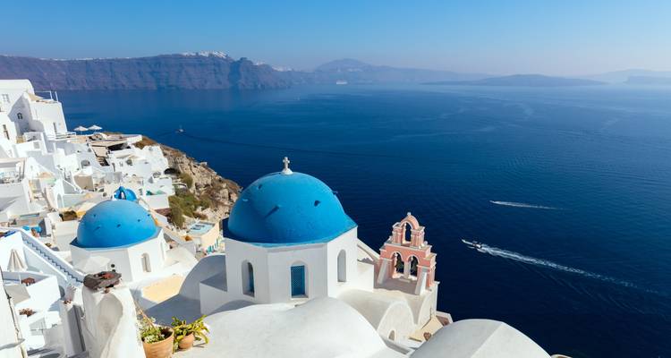 Santorini's blue domes overlooking the Aegean Sea.