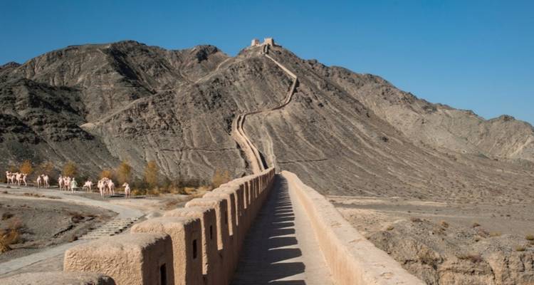 Gansu Great Wall stretching over a mountain.