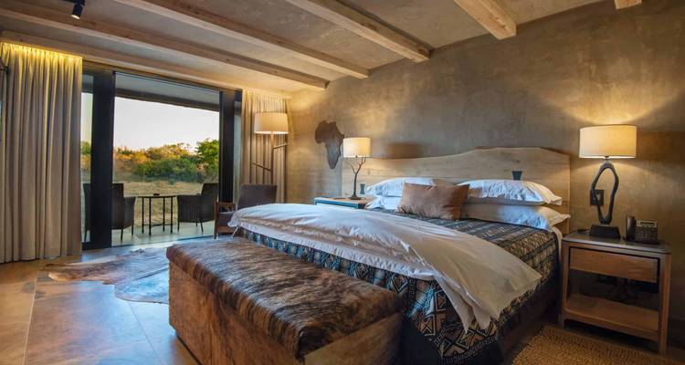 Elegant hotel room with a view of the outdoors.