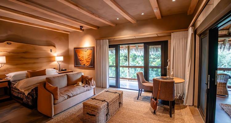 Stylish hotel suite with natural lighting and chic decor.