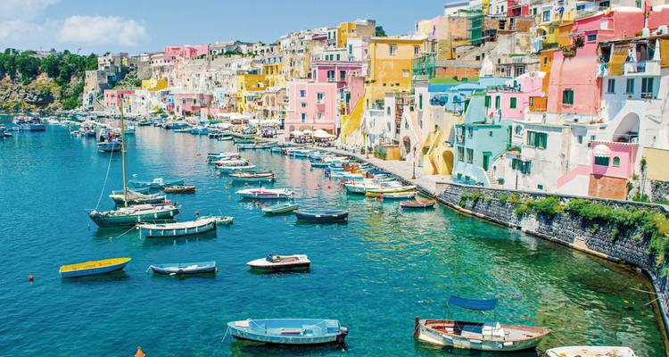 Colorful harbor with boats in Procida.