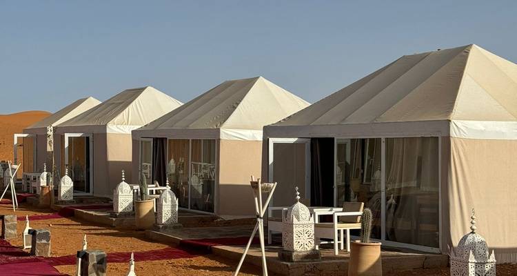 Tent scene in the desert.