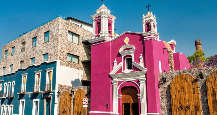 Colorful church against a bright blue sky.