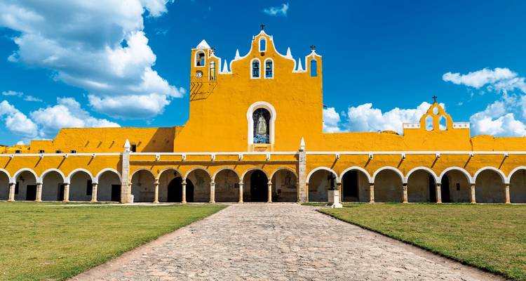 Colorful colonial monastery architecture under a bright sky.