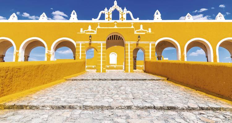 Monastery entrance with vibrant yellow walls.