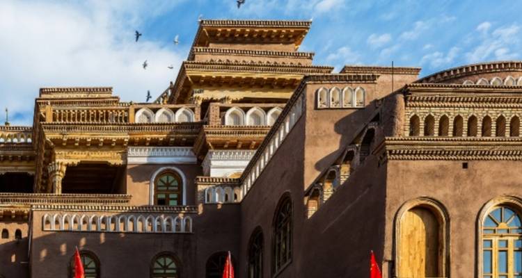Traditional architecture with intricate details under a clear blue sky.