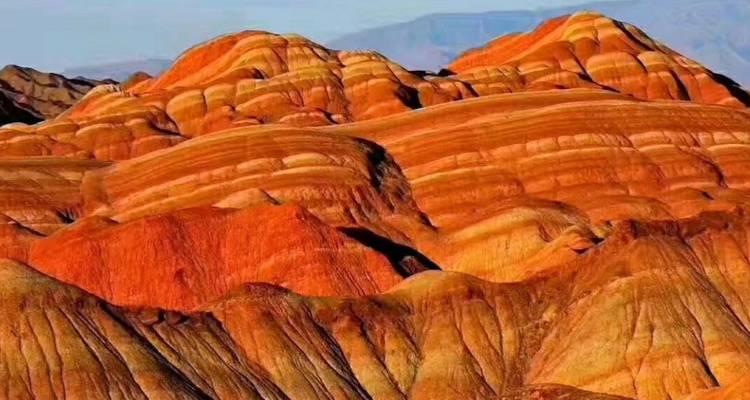 Colorful rock formations resembling layers of painted hills.
