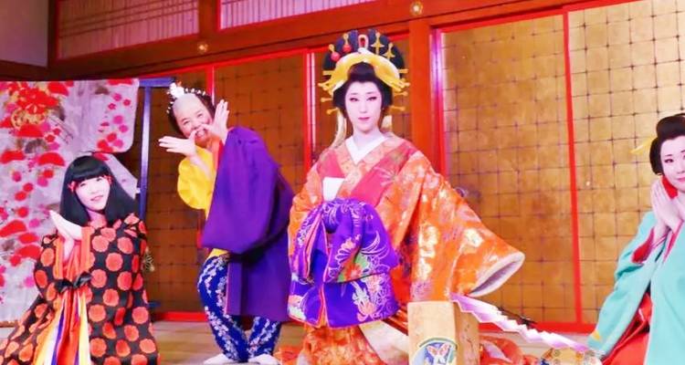 Traditional Japanese cultural performance with people in colorful attire.