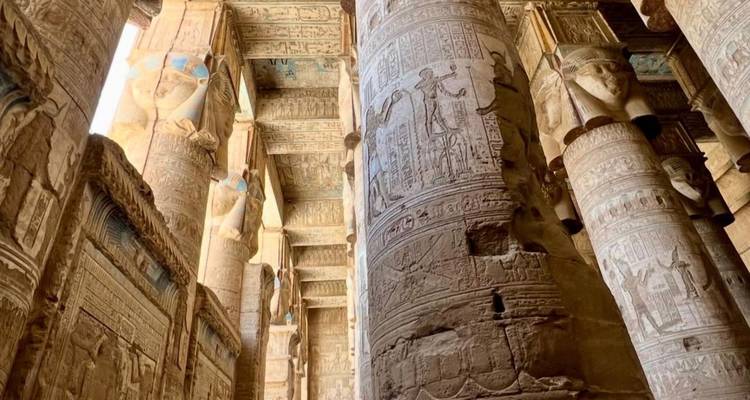 Inside view of an Egyptian temple with detailed columns.