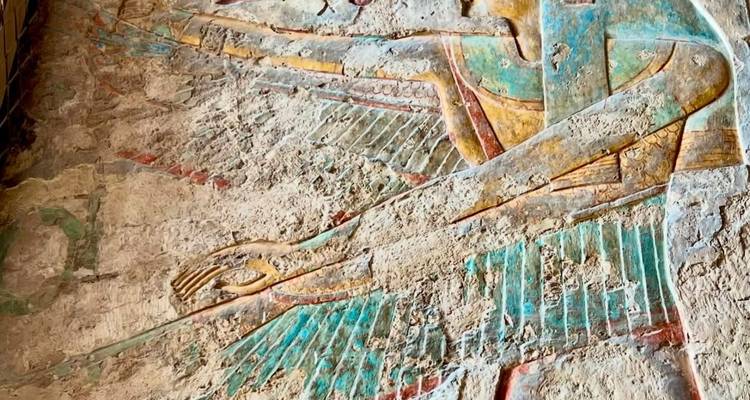 Ancient Egyptian artwork on a stone wall.