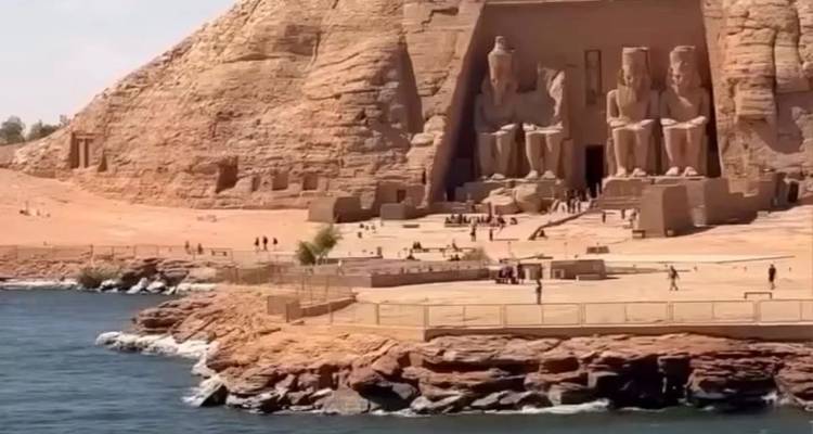 Abu Simbel temples with a water view.