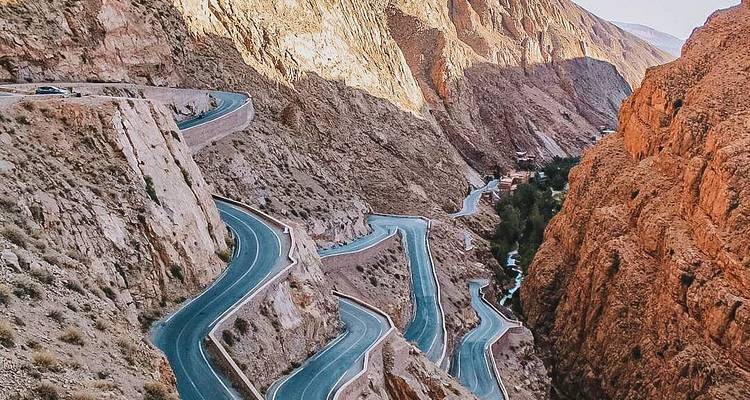 Winding road through steep mountainous terrain.