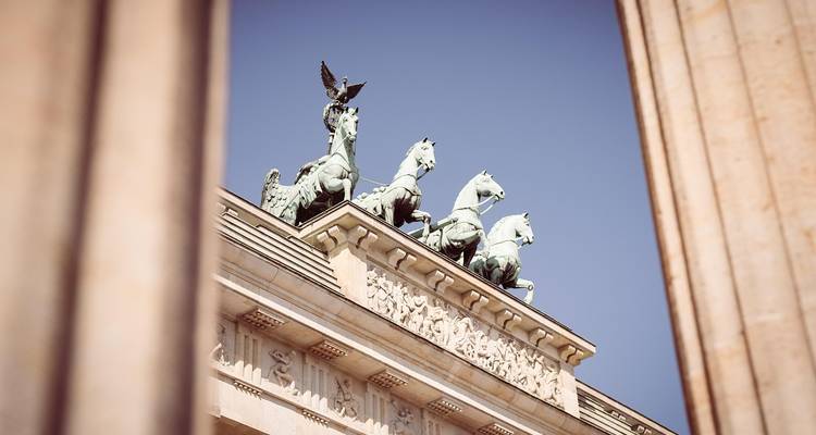 View of Quadriga between columns of the Brandenburg Gate.