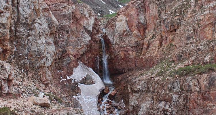 Waterfall cascading through rocky cliffs