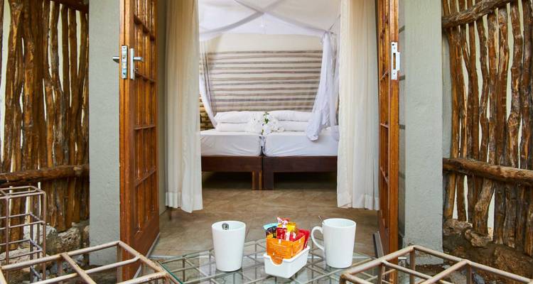 An inviting lodge room with open doors to a patio.