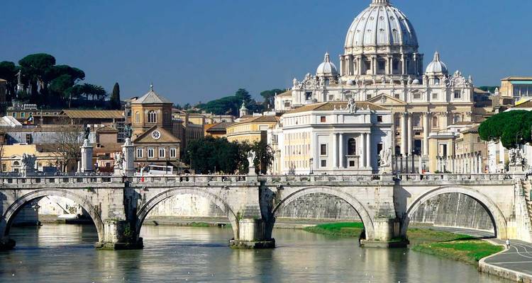 Classic view of a historic basilica and bridge over a river.