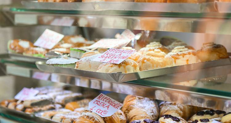 Display case showcasing various pastries.