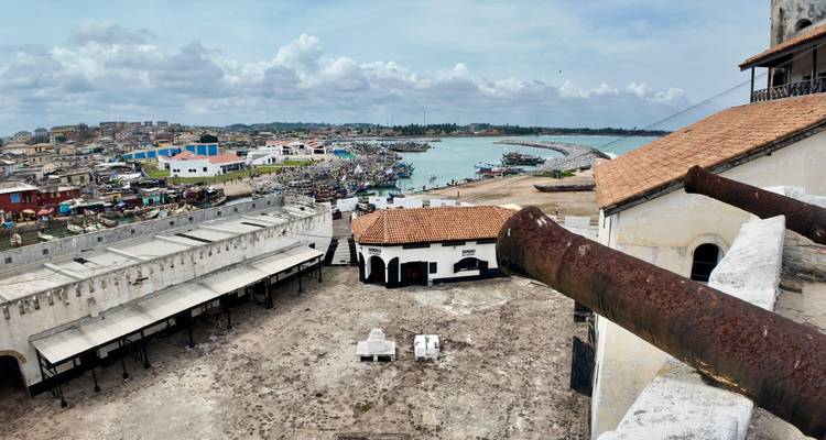 View from a fort overlooking a coastal city.