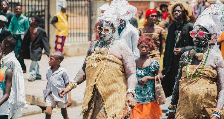 Cultural parade with vibrant costumes and music.