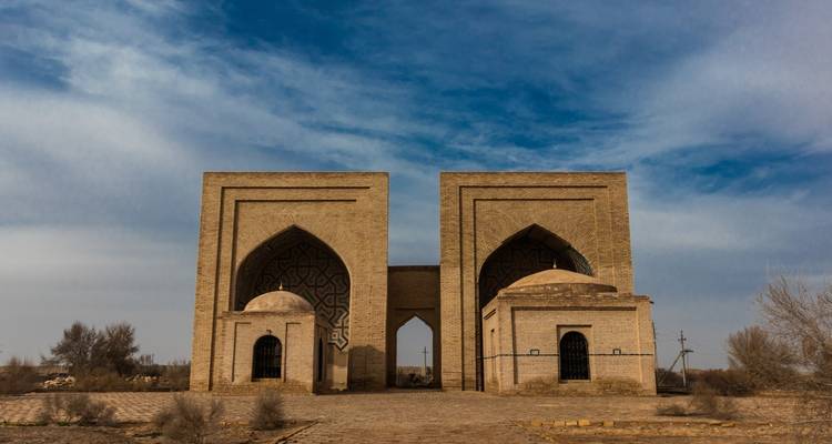 Old architectural structures against a cloudy sky.
