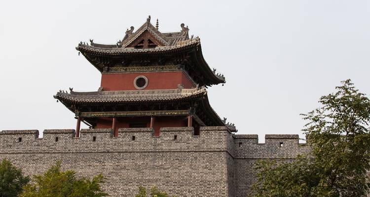 Traditional Chinese tower on a section of an ancient wall.