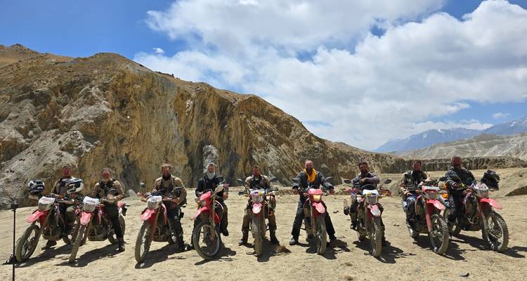 Group of bikers posing on their motorcycles.