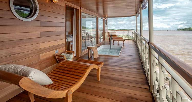 Wooden balcony with a river view on a luxury cruise