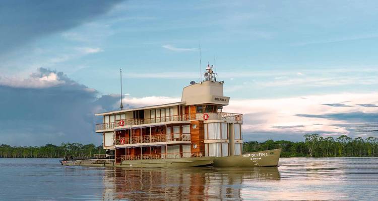 Luxury cruise ship on a river under a vibrant sky