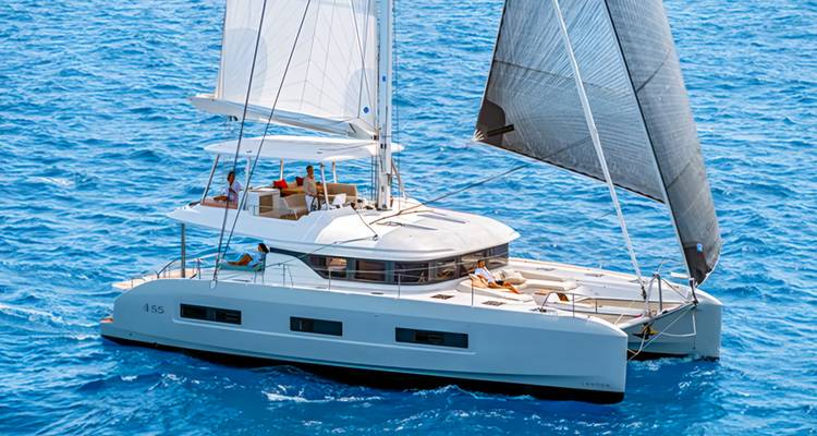 Sailing catamaran with people on a sunny day.